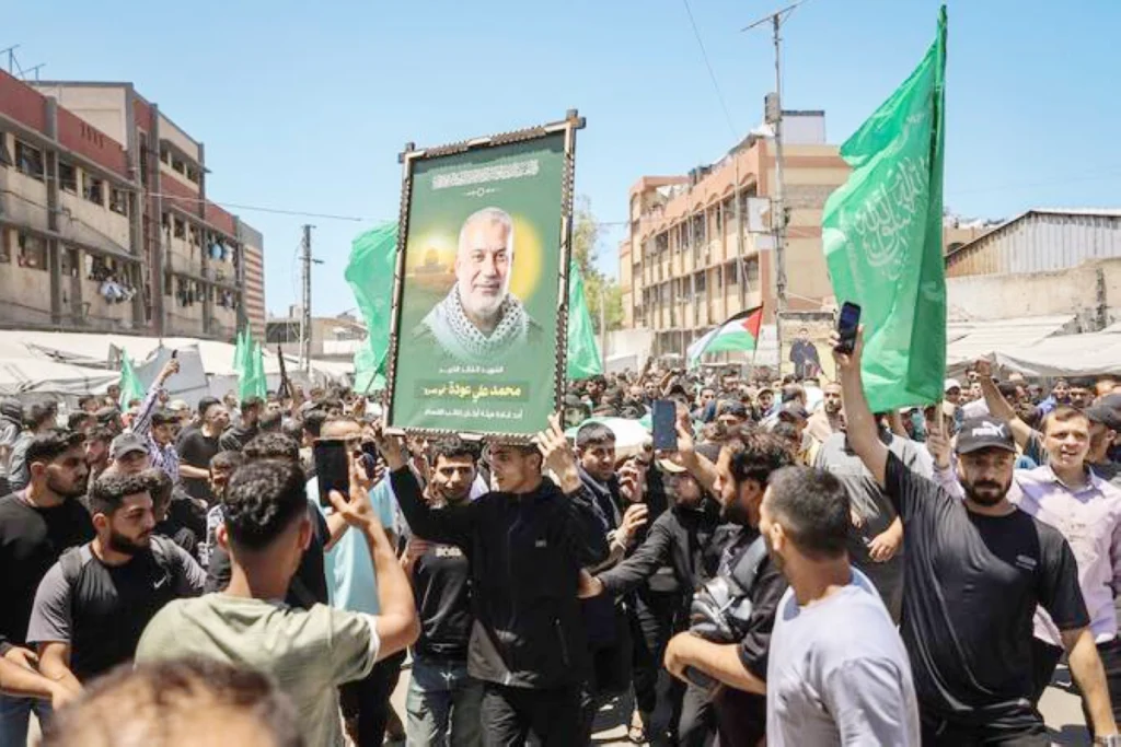 Palestinians mourn slain Hamas leader as Israel escalates attacks in Gaza